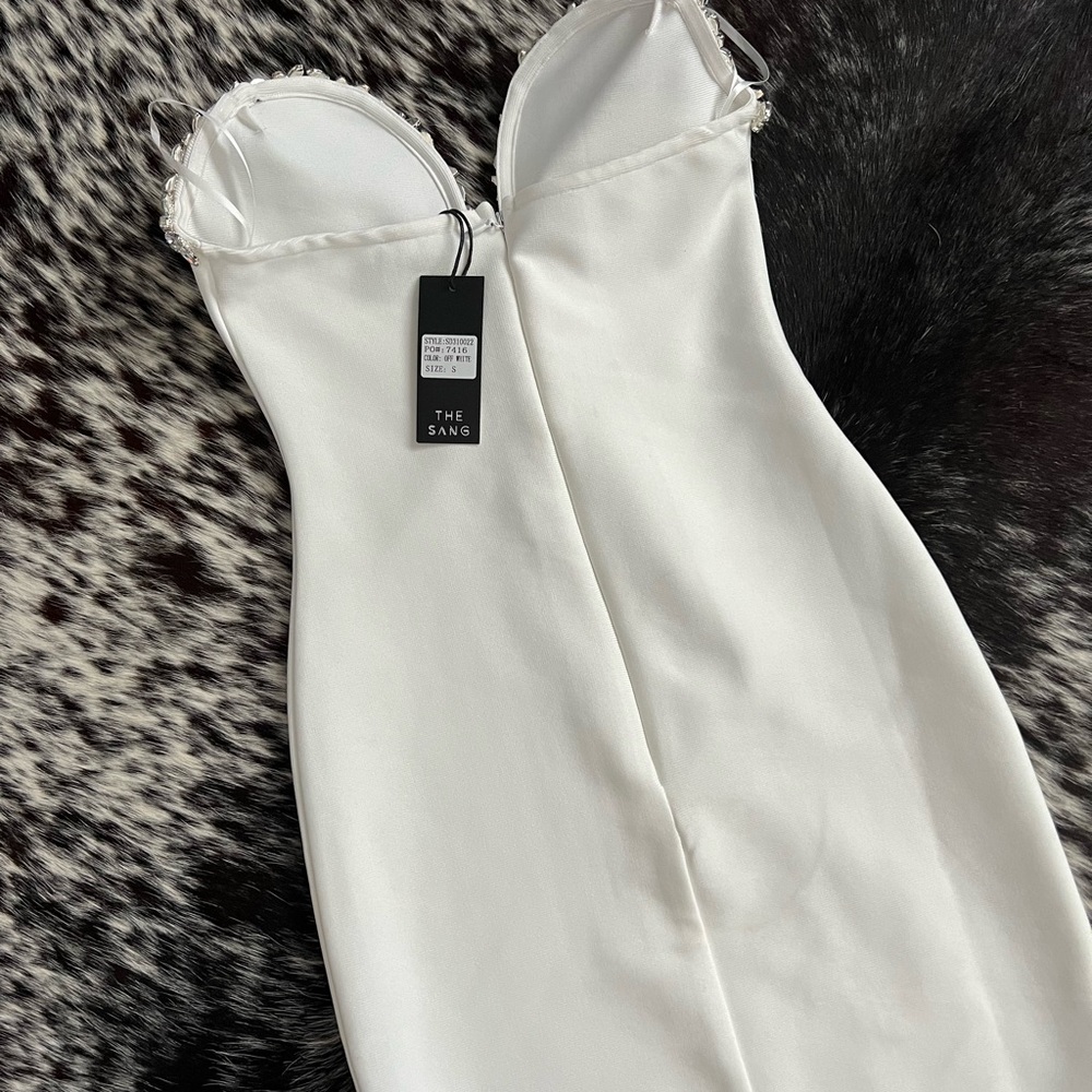 White dress with jeweled sweetheart top.